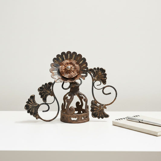 Metal Morph Sculpture handcrafted steel sunflower garden art made from repurposed vintage metal objects on a white table