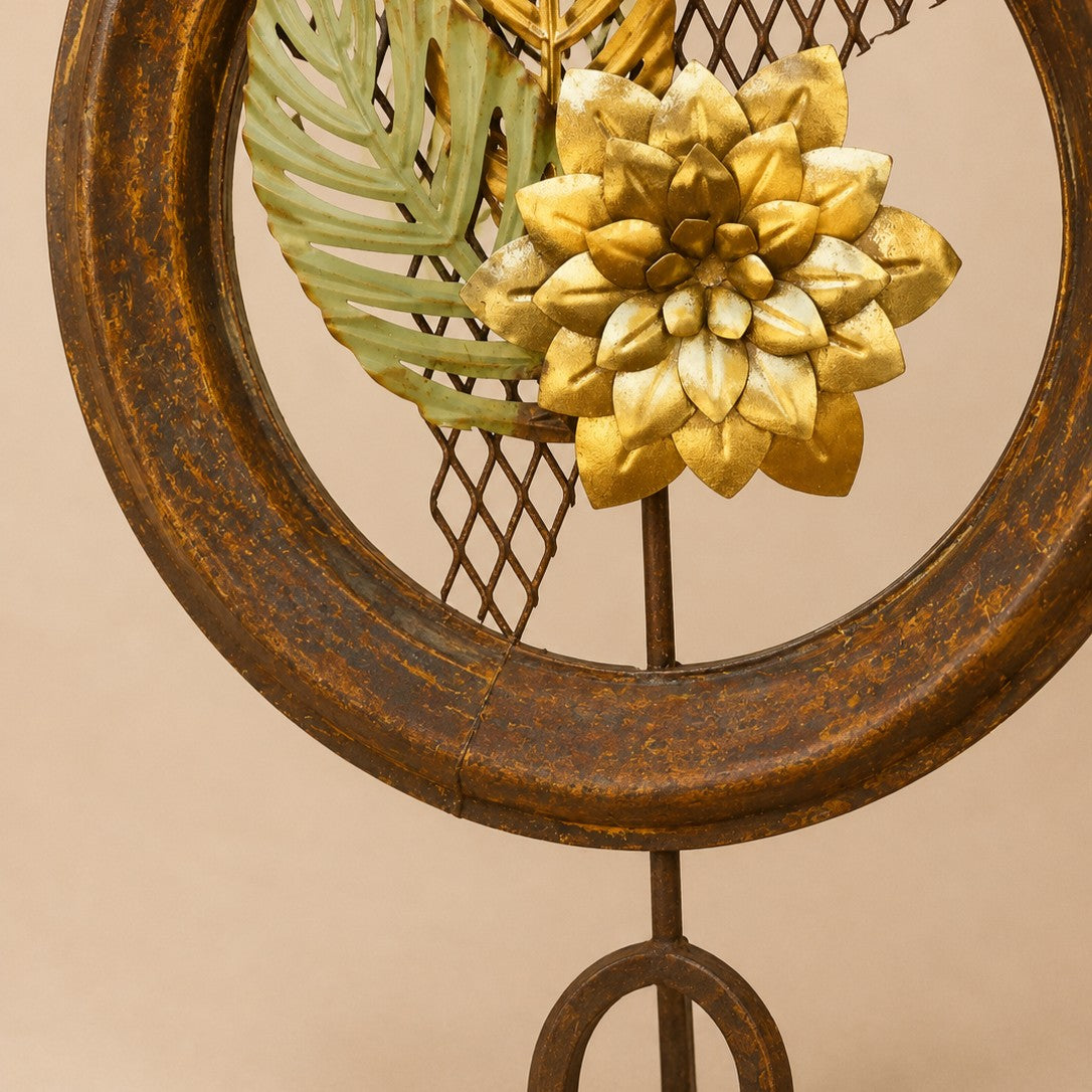 Metal Morph Sculpture The Hybrid Bloom handcrafted freestanding metal art with a golden flower and green palm leaves.