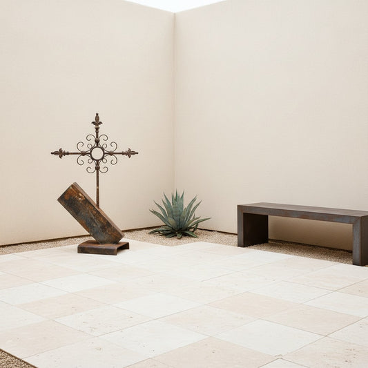 Metal Morph Sculpture The Iron Summit, a reclaimed steel cross sculpture with a rustic patina in a modern courtyard.