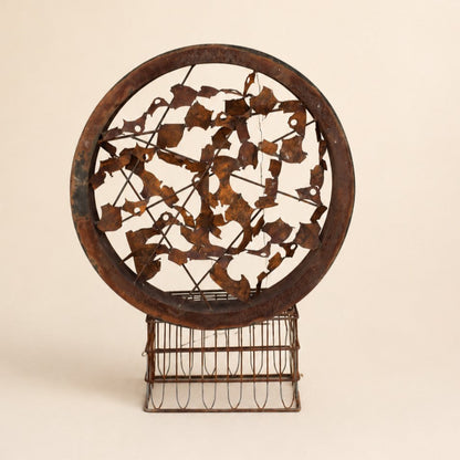 Metal Morph Sculpture Rust & Radius circular steel art piece with a rusted patina finish on a vintage metal base.