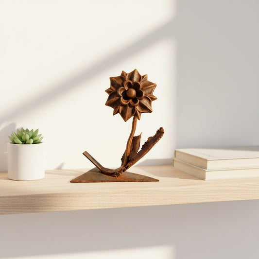 Metal Morph Sculpture handcrafted copper and steel dahlia flower art piece with a bronze patina on a wooden shelf.