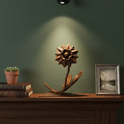 Metal Morph Sculpture handcrafted copper and steel dahlia flower art piece with a bronze patina on a wooden mantel.
