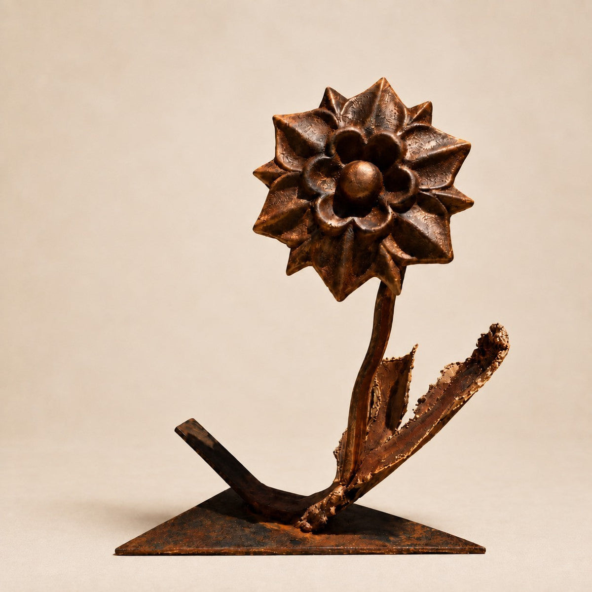 Metal Morph Sculpture Copper Dahlia original metal flower art with a warm bronze patina on a flat triangular base.