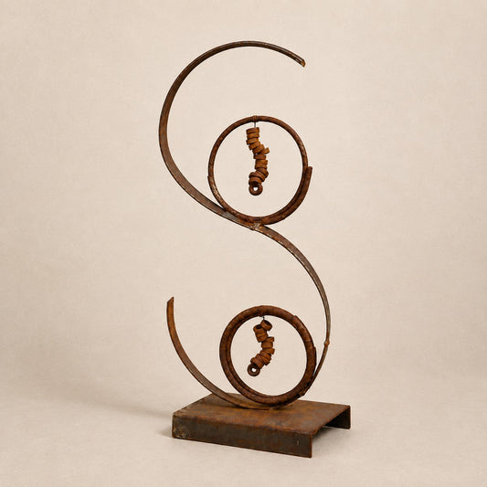 Metal Morph Sculpture Desert Swirl abstract steel art with rusted patina, curved lines, and industrial metal accents.