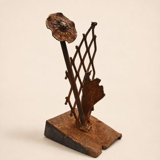 Metal Morph Sculpture Garden Gate Bloom original steel flower sculpture with a salvaged lattice and raw metal finish.