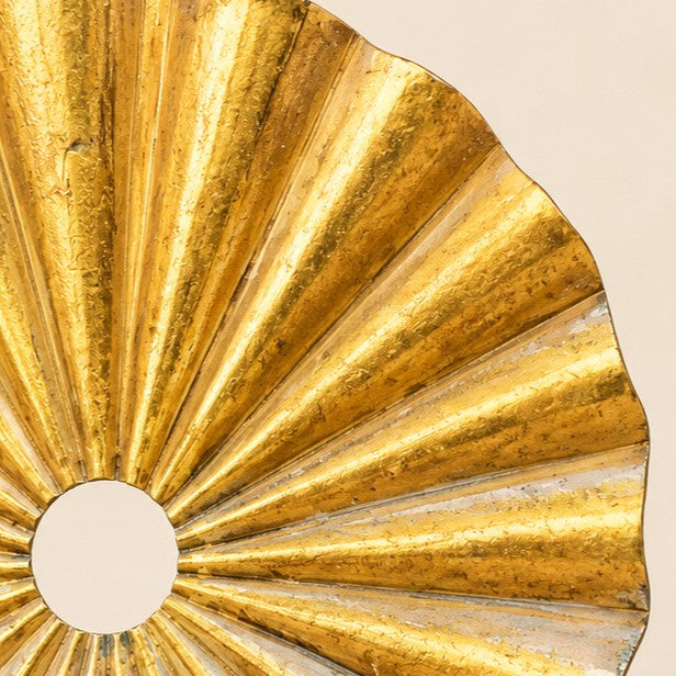 Metal Morph Sculpture Zig Zag Sun detail showing the radiant gold-toned metal sun centerpiece with textured finish.