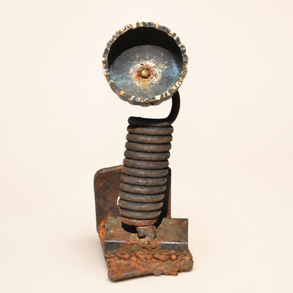 Metal Morph Sculpture handcrafted floral sculpture made from industrial scrap metal with a coiled spring and dark finish