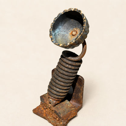 Metal Morph Sculpture handcrafted floral art piece made from industrial scrap metal with a coiled spring stem.