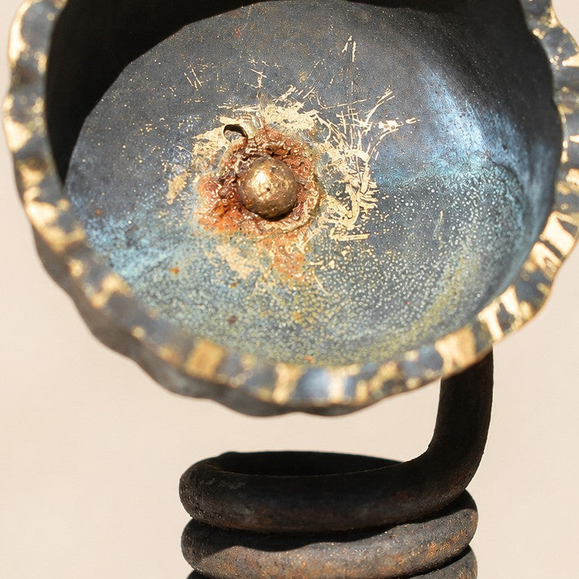 Metal Morph Sculpture handcrafted floral art made from industrial scrap with a weathered patina and coiled base