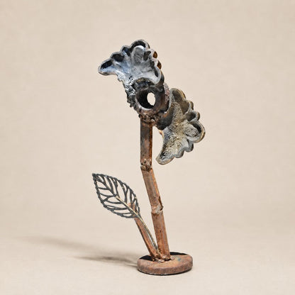 Metal Morph Sculpture Little Bloom handcrafted steel flower sculpture with a fan-shaped head and gold outline leaf.