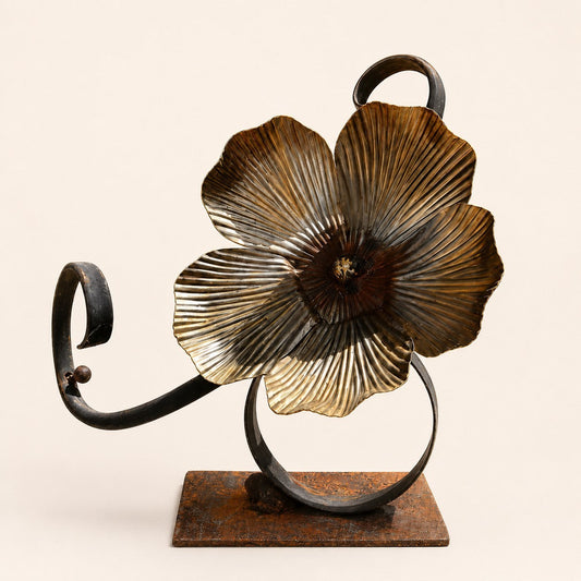 Metal Morph Sculpture Flourish handcrafted steel botanical flower art with ribbed petals and sweeping scroll accents.