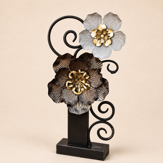 Metal Morph Sculpture The Heavy Petal steel floral art piece with layered metallic blooms and black scrollwork base.