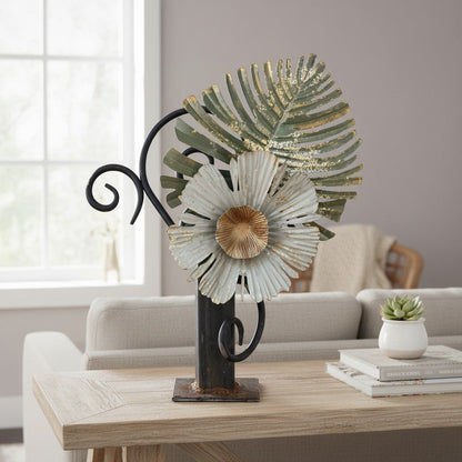 Metal Morph Sculpture handcrafted industrial steel sculpture featuring a rusted metal flower and leaf on a table.