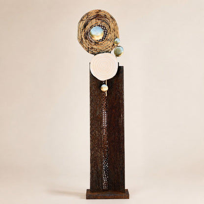Metal Morph Sculpture Madame Orbit handcrafted floor sculpture featuring raw steel, metallic spheres, and spiral discs.