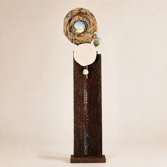 Metal Morph Sculpture Madame Orbit handcrafted floor sculpture featuring raw steel, metallic spheres, and spiral discs.