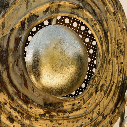 Close-up of Metal Morph Sculpture Madame Orbit featuring a weathered gold metallic sphere centered in layered rings