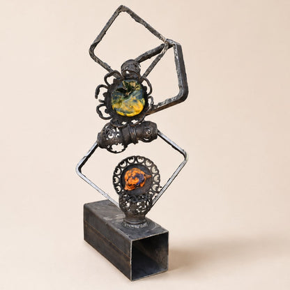 Metal Morph Sculpture Molten Geometry mixed-media art featuring salvaged steel frames, vintage cast iron, and glass.