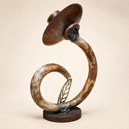 Metal Morph Sculpture The Unlikely Flower handcrafted reclaimed metal art piece with a rustic patina and leaf detail.