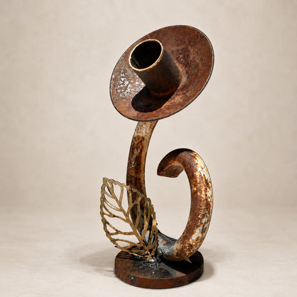Metal Morph Sculpture handcrafted reclaimed metal flower art with a rustic patina and brass leaf detail.