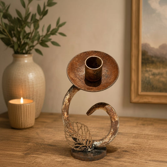 Metal Morph Sculpture The Unlikely Flower handcrafted reclaimed metal art piece with a rustic patina on a wooden desk