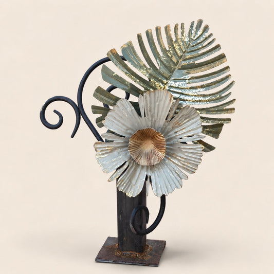 Metal Morph Sculpture The Iron Jungle handcrafted industrial steel art featuring a rusted metal flower and leaf design.