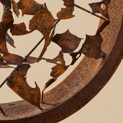 Metal Morph Sculpture circular steel art piece featuring a heavy rusted frame with intricate welded rod details.