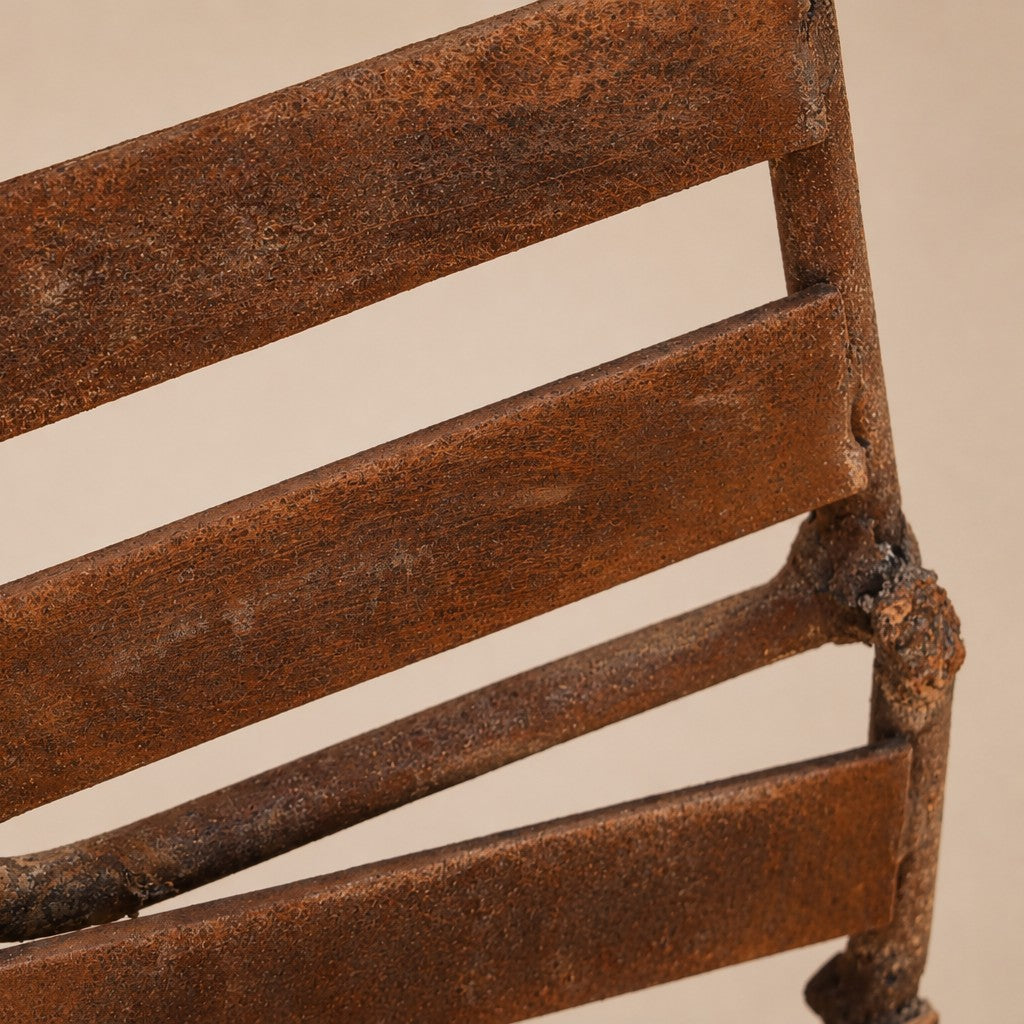 Close-up of Metal Morph Sculpture Starbound showing the textured rustic patina on the industrial steel frame.