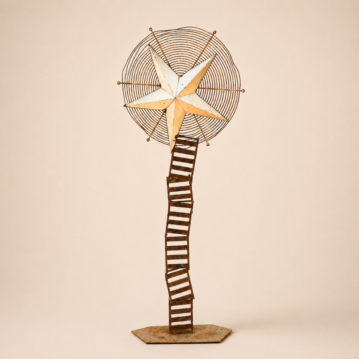 Metal Morph Sculpture Starbound kinetic floor sculpture featuring a rustic metal star and vintage ventilation wheel.