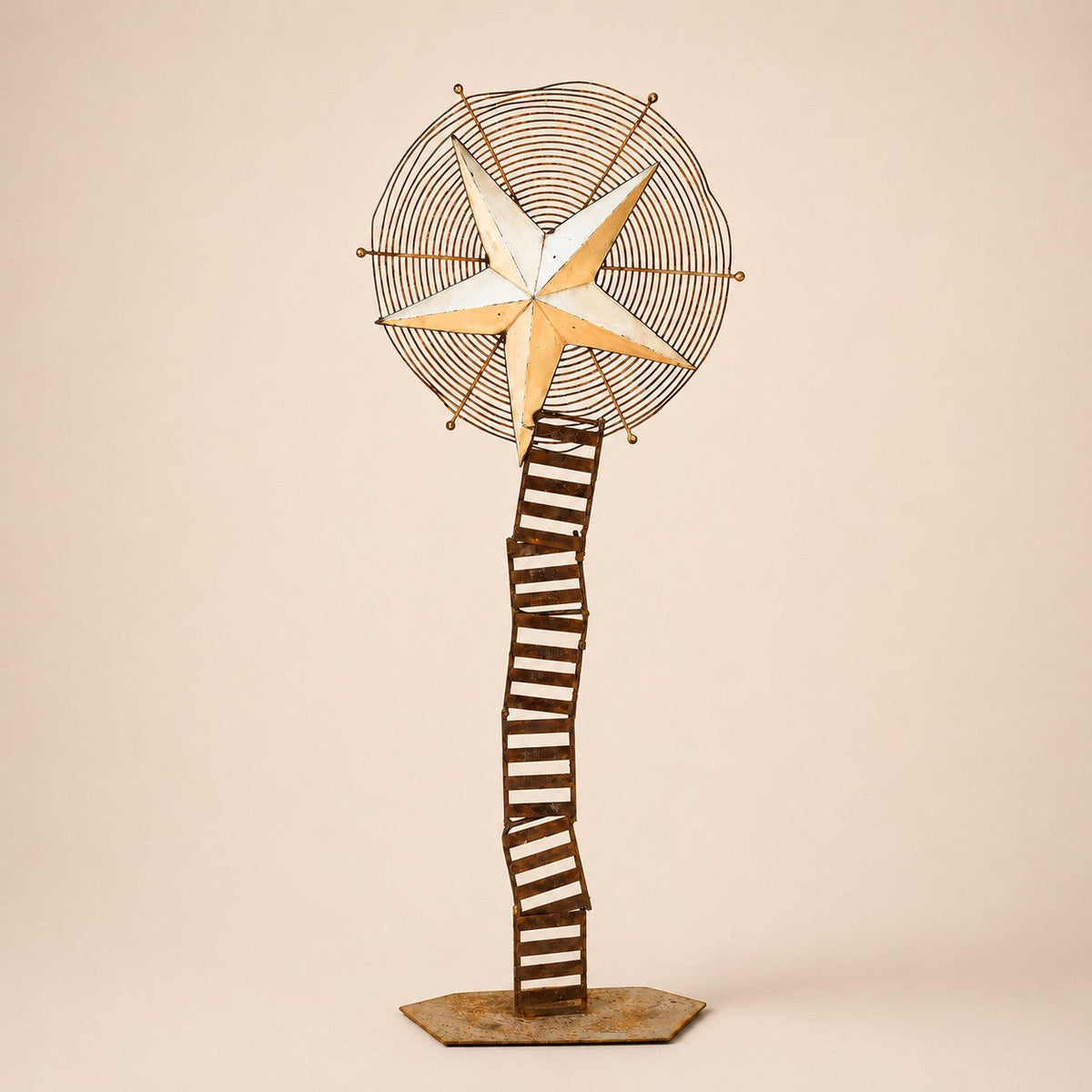 Metal Morph Sculpture Starbound kinetic floor sculpture featuring a rustic metal star and vintage ventilation wheel.