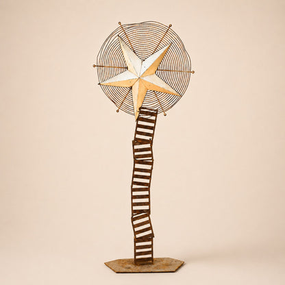 Metal Morph Sculpture Starbound kinetic floor sculpture featuring a rustic metal star and vintage ventilation wheel.