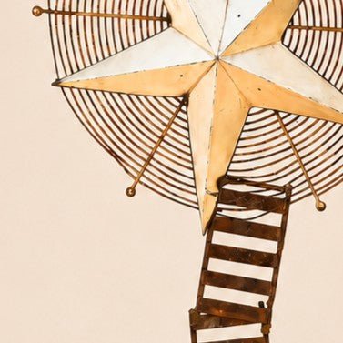 Metal Morph Sculpture Starbound kinetic floor art featuring a rustic metal star and vintage ventilation wheel topper.