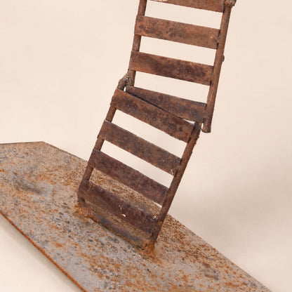 Metal Morph Sculpture Starbound kinetic floor sculpture base made of rustic industrial steel with a weathered patina.