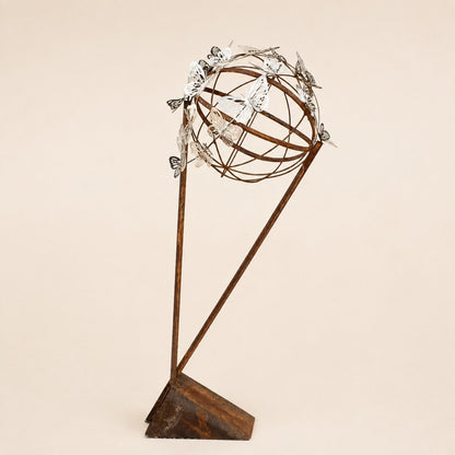 Metal Morph Sculpture Steel Migration abstract art piece featuring a spherical cage with silver butterfly accents