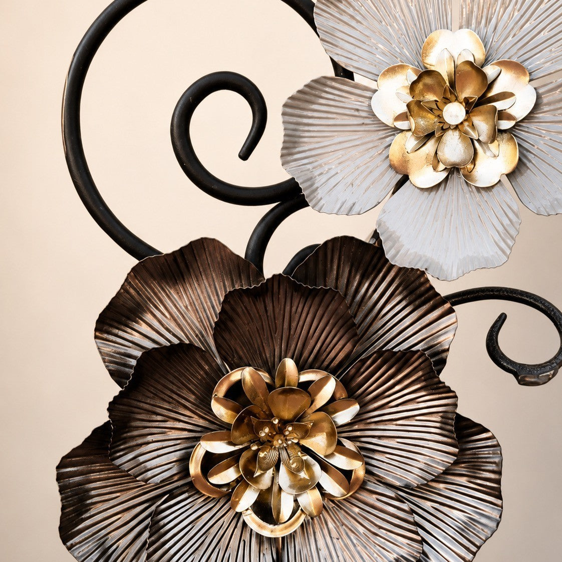 Metal Morph Sculpture The Heavy Petal steel floral sculpture featuring layered metallic blooms and scrollwork details.