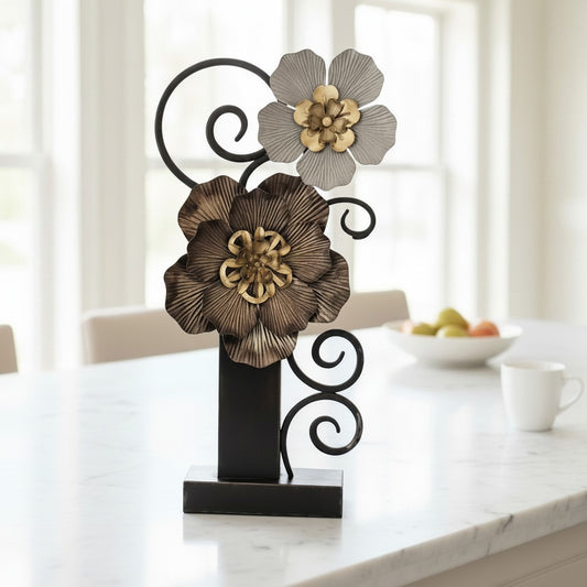Metal Morph Sculpture The Heavy Petal handcrafted steel floral art with layered blooms and scrollwork on a table.
