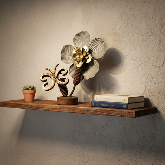 Metal Morph Sculpture handcrafted steel flower and copper butterfly art piece displayed on a wooden wall shelf.