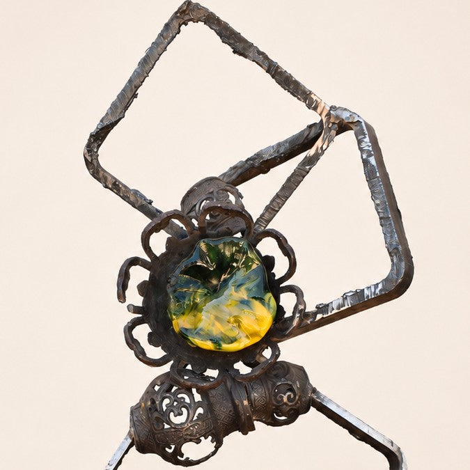Metal Morph Sculpture Molten Geometry mixed-media art featuring raw steel frames and a colorful handmade glass flower.