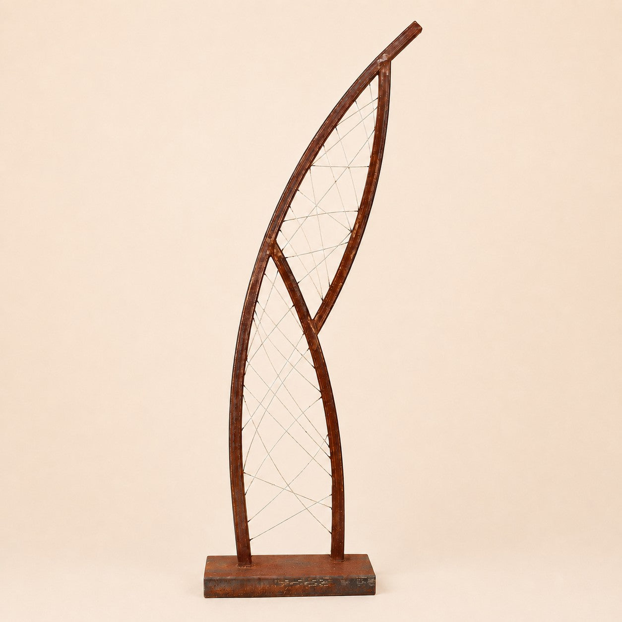 Metal Morph Sculpture Steel Lattice Arc featuring a curved rusted metal frame with intricate wire mesh detailing.