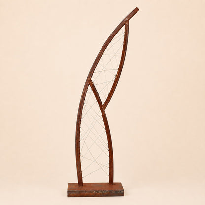Metal Morph Sculpture Steel Lattice Arc featuring a curved rusted metal frame with intricate wire mesh detailing.